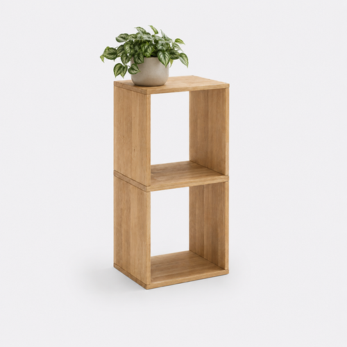 A two-tier wooden cube side table with open cubby shelves, shown on a light gray background with a potted green plant on top.
